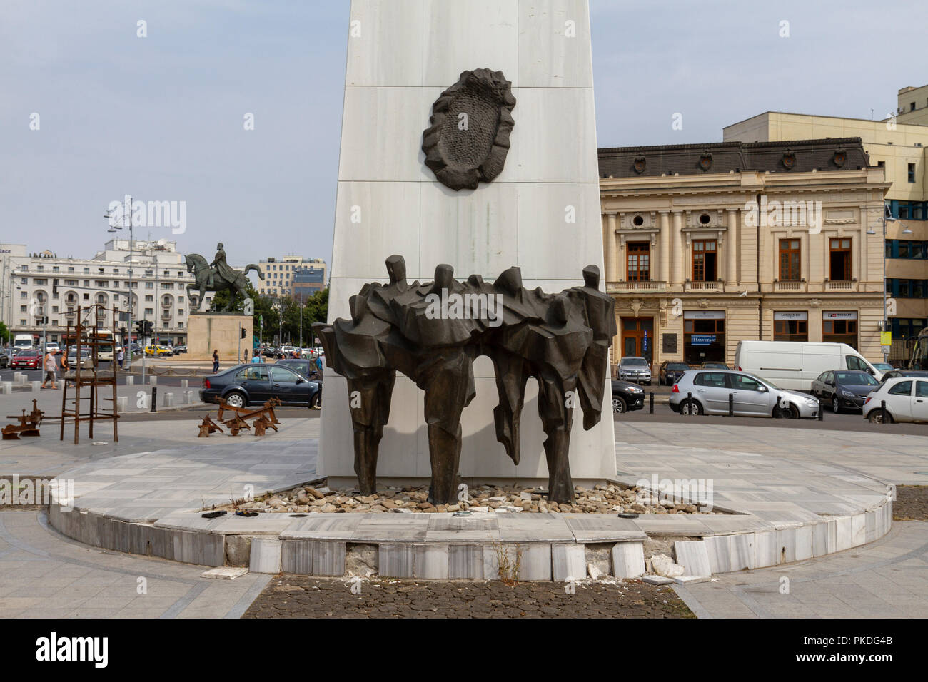 The Memorial of Rebirth, Revolution Square, with the former Central Committee building, Bucharest, Romania. Stock Photo