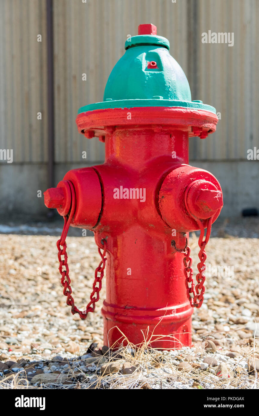 Red fire hydrant with green top Stock Photo