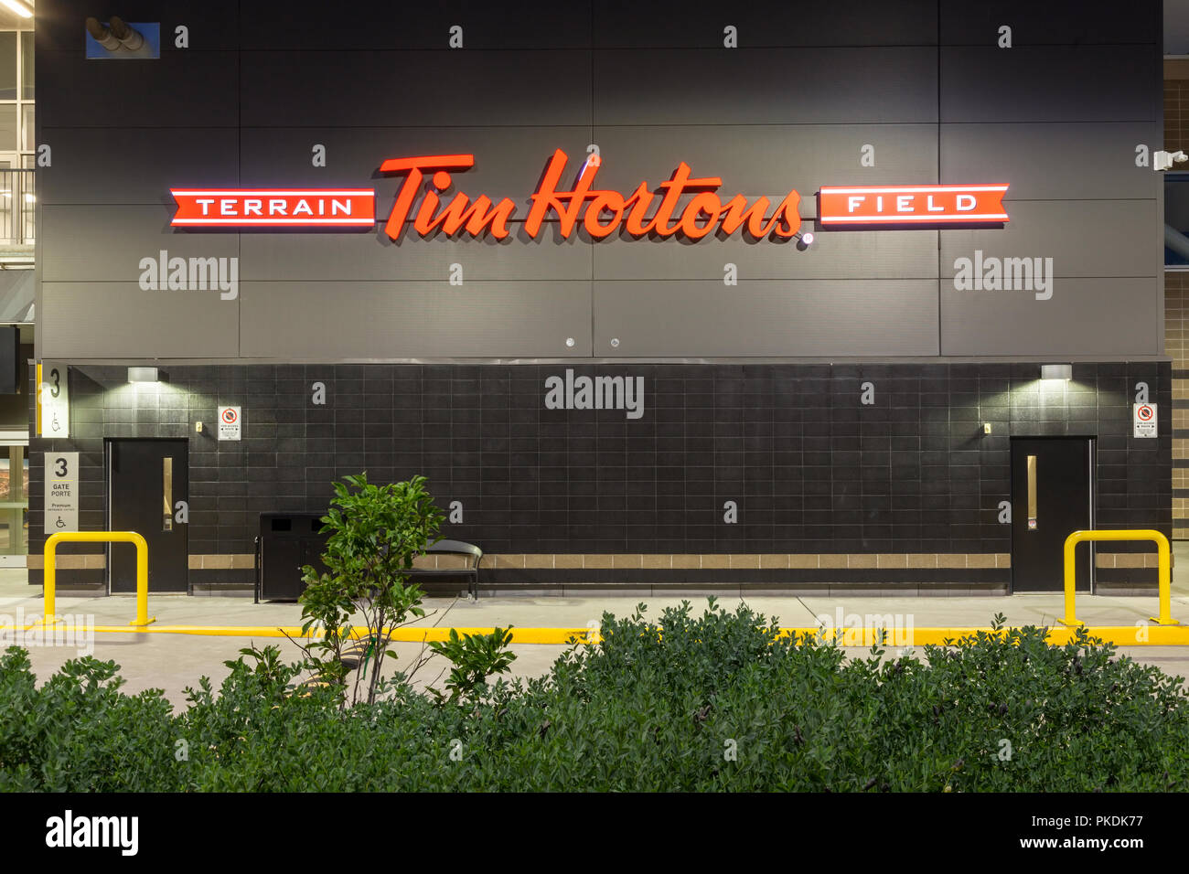 The Tim Hortons Field logo (CIBC Hamilton Pan Am Soccer Stadium) at dusk in Hamilton, Ontario, Canada. Stock Photo