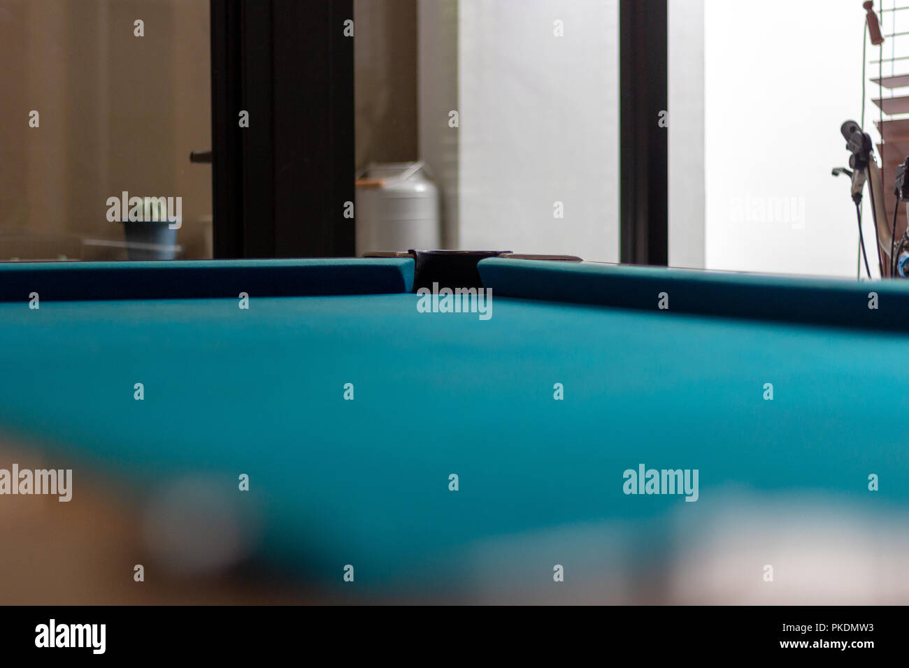 Empty snooker table and corner view with hole. Empty billiard pool table with blue cloth Stock Photo