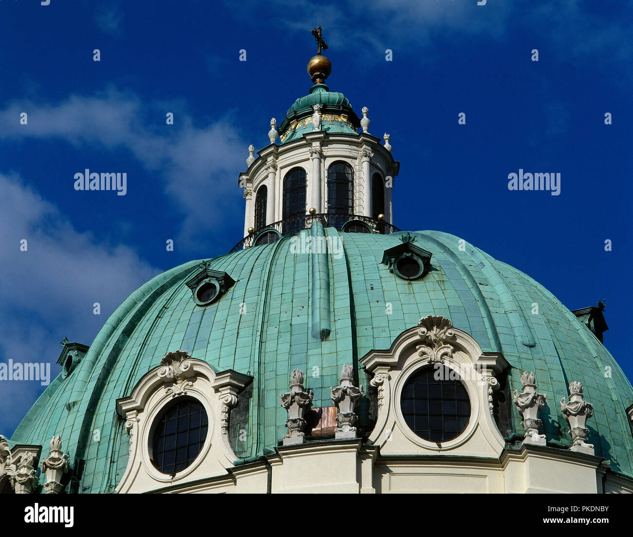 Johann Bernhard Fischer von Erlach (1656-1723). Karlskirche (St. Charles Church). Baroque style. 1716-1737. Dedicated to St. Charles Borromeo. Detail of the great dome crowned by a cross. Vienna. Austria. Stock Photo