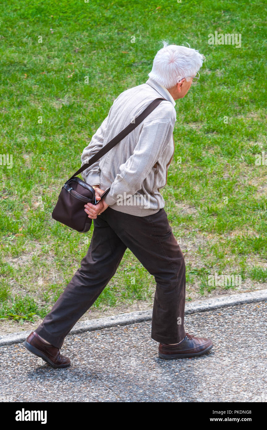 Old man on pavement - France. Stock Photo