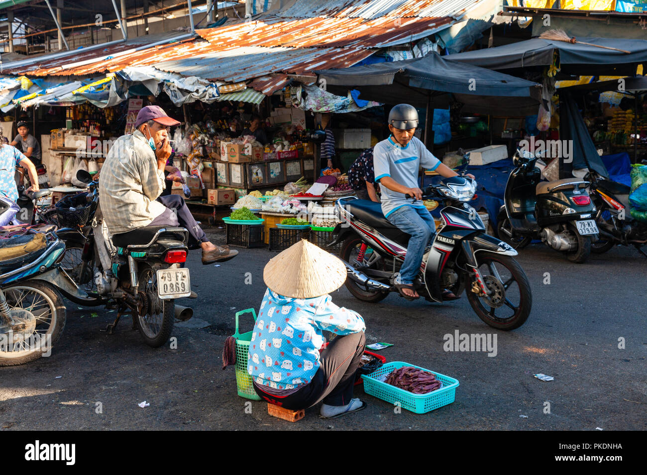 NHA TRANG, VIETNAM - AUGUST 06: A woman sells dried fish at the street market on August 06, 2018 in Nha Trang, Vietnam. Stock Photo