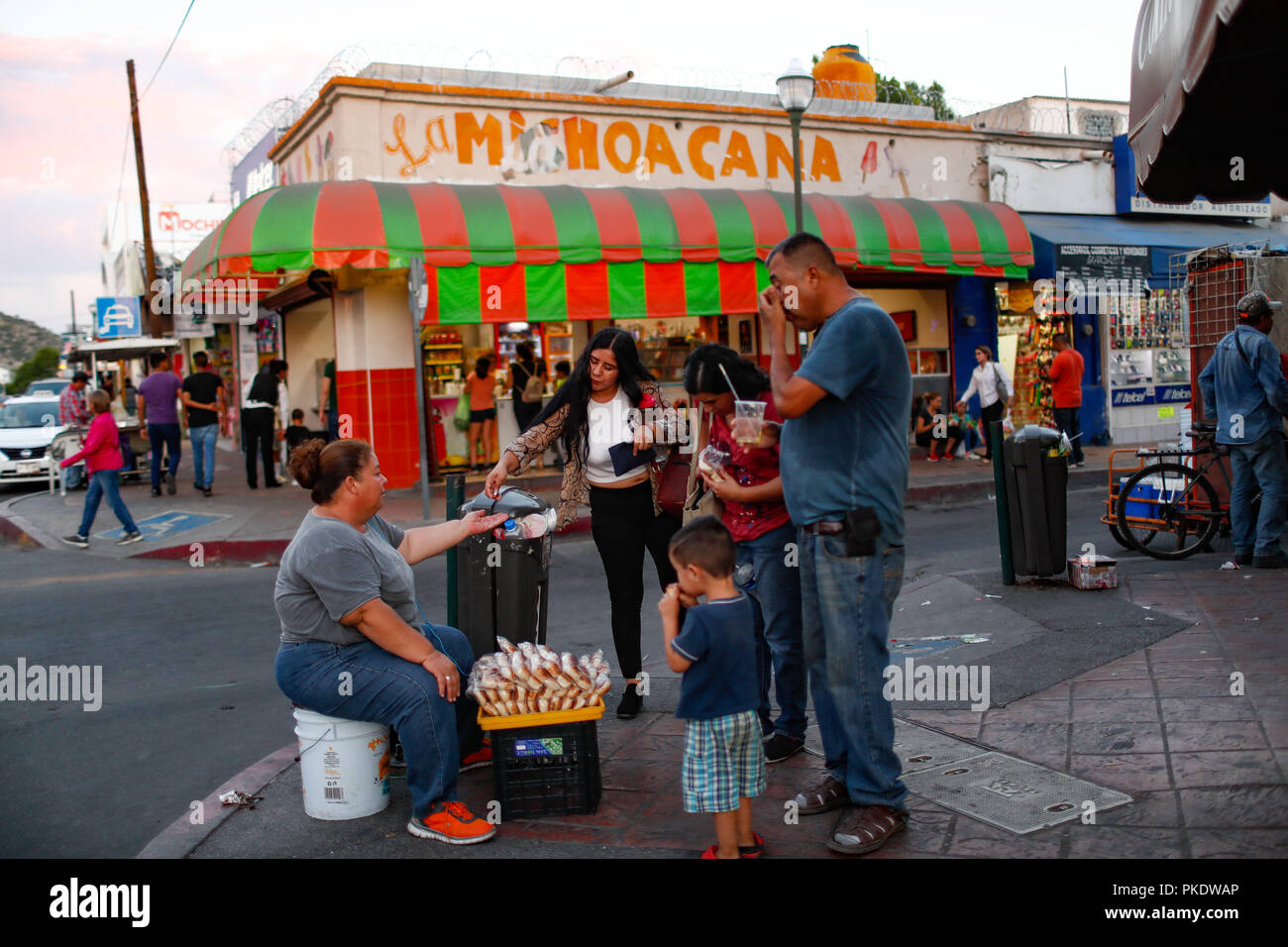 Sale of products on the ramrod. in the background LA MICHOACANA.   Daily life in the historic center of Hermosillo, Sonora, Mexico. Street Photography. (Photo: Luis Gutierrez /NortePhoto) Stock Photo