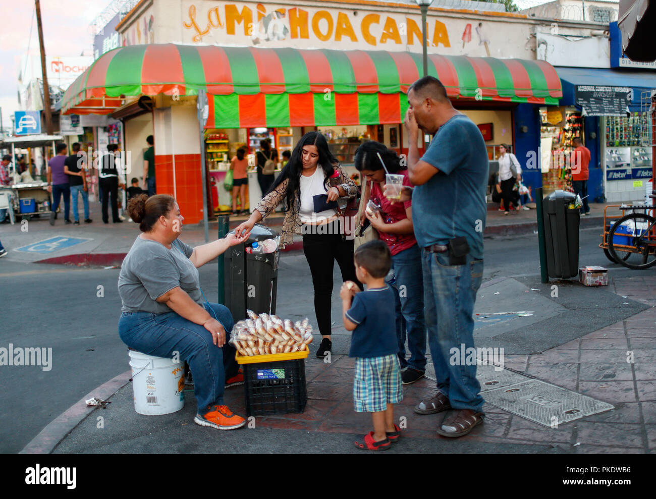 Sale of products on the ramrod. in the background LA MICHOACANA.   Daily life in the historic center of Hermosillo, Sonora, Mexico. Street Photography. (Photo: Luis Gutierrez /NortePhoto) Stock Photo