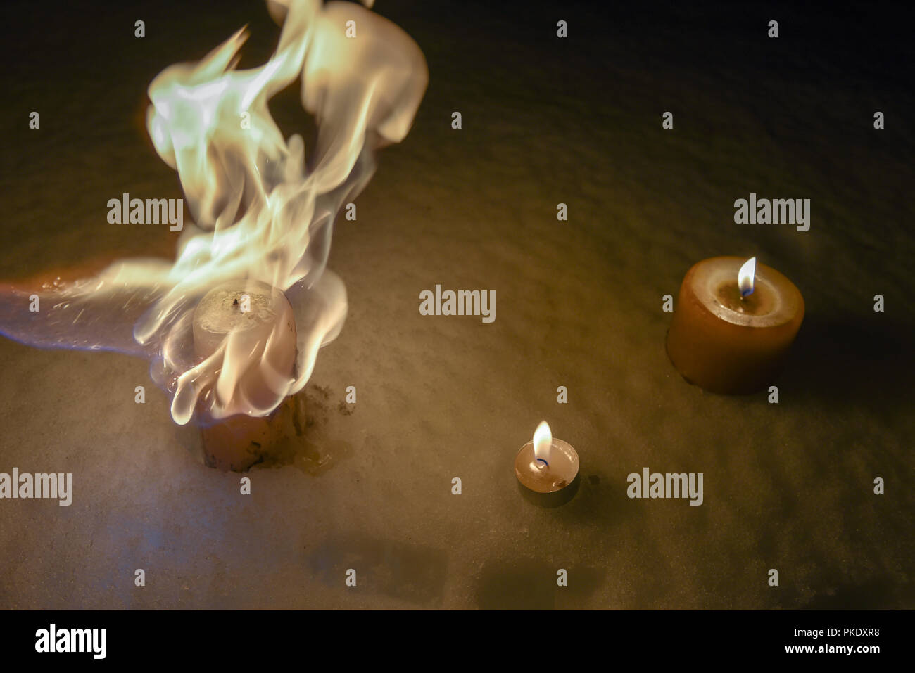 Burning candles at night on the Snow Stock Photo Alamy