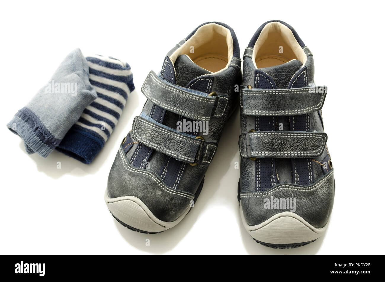 Baby boy shoes and socks isolated on a white background Stock Photo - Alamy