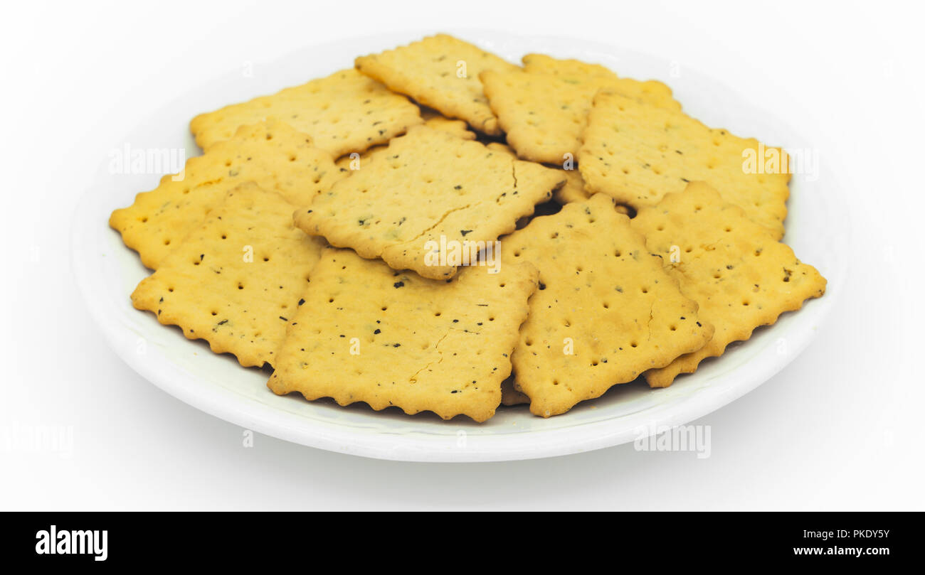 crackers in plate on white Stock Photo