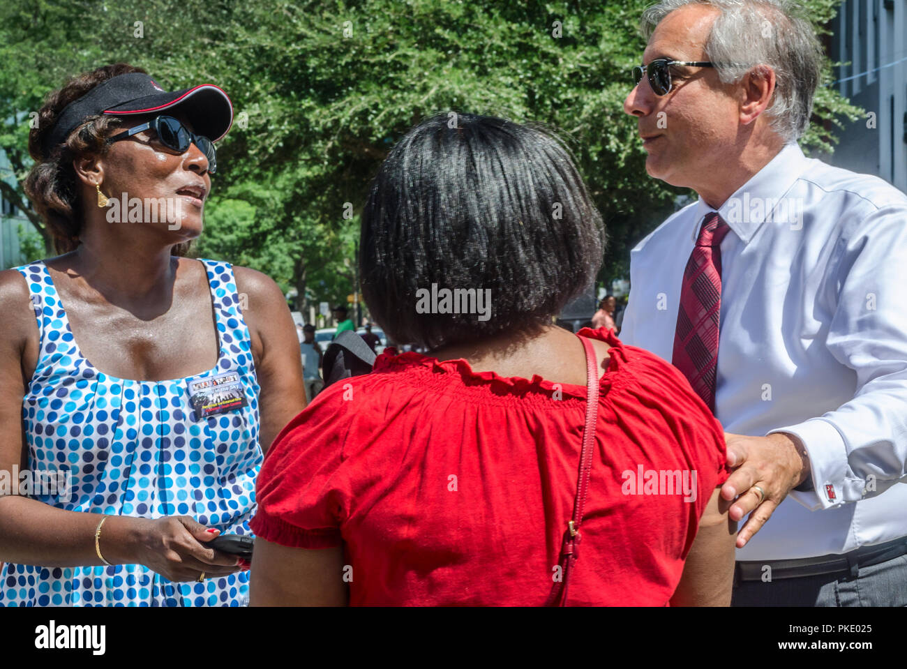 Women thank University of South Carolina President Harris Pastides for removing the Confederate flag, July 10, 2015, in Columbia, South Carolina. Stock Photo