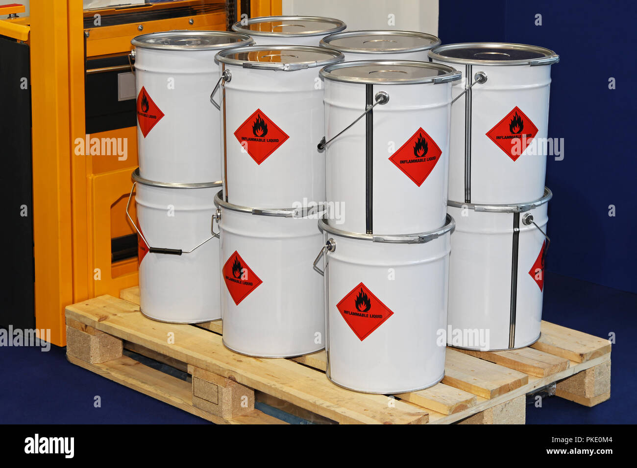 Flammable liquid in containers at pallet forklift Stock Photo