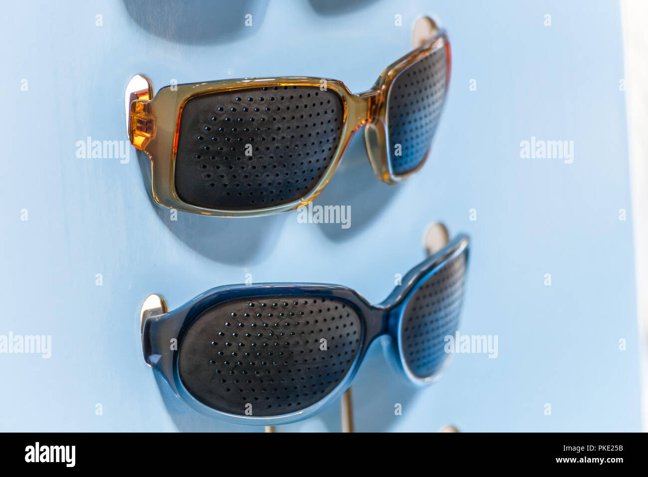 Pinhole glasses hi res stock photography and images Alamy
