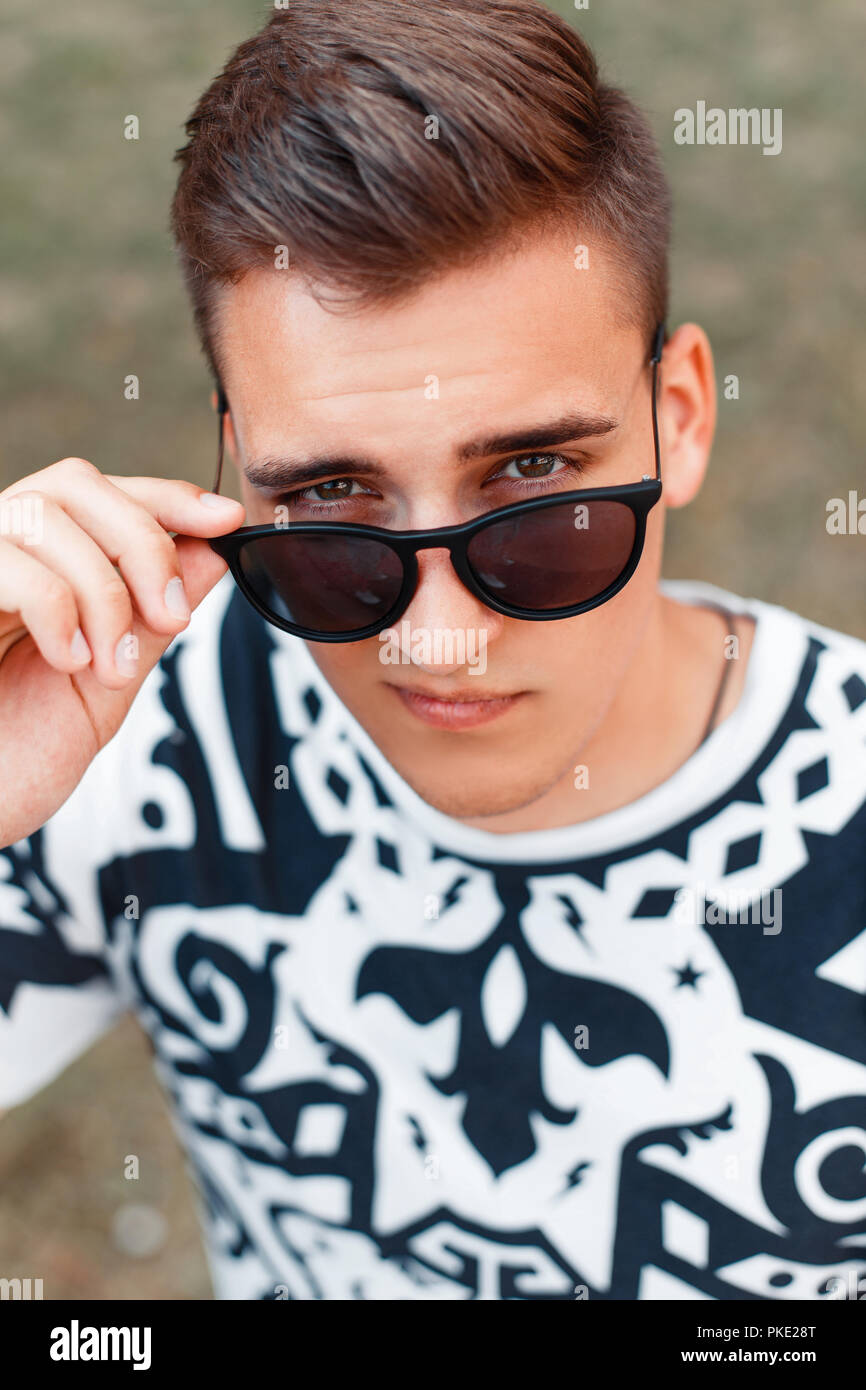 Handsome young man sunglasses hi-res stock photography and images - Alamy