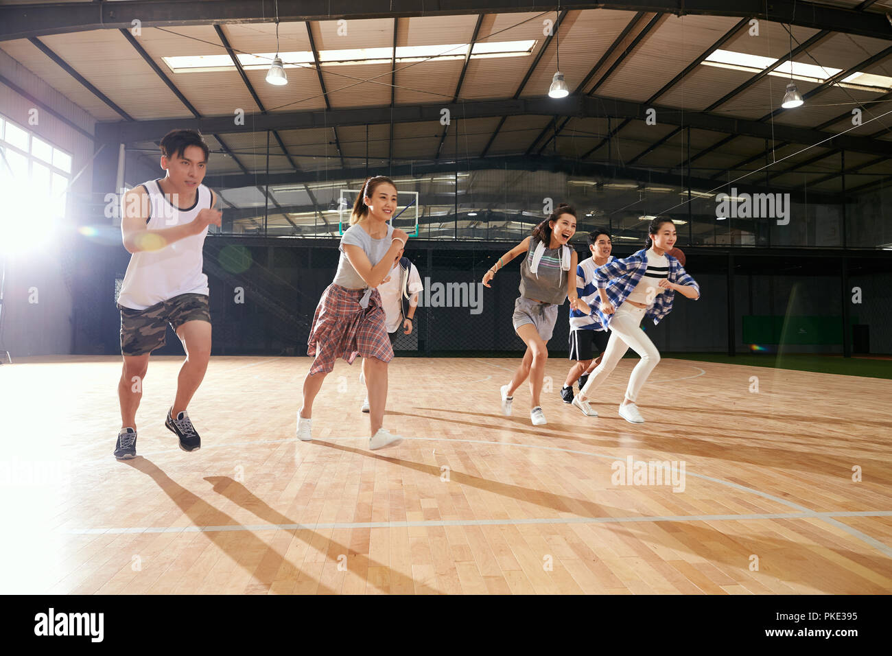Young men and women in the basketball stadium Stock Photo Alamy