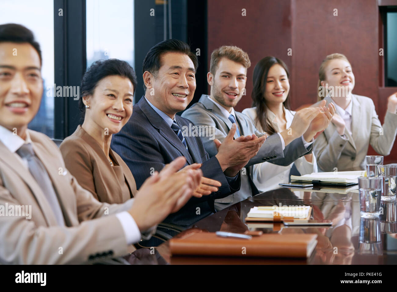 Business men and women in a meeting Stock Photo - Alamy