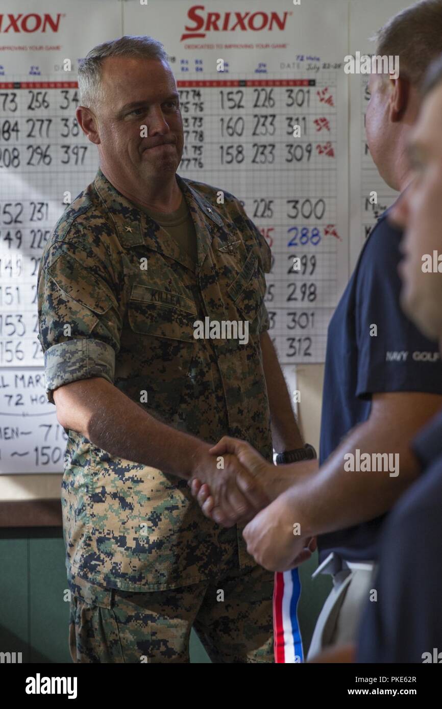 Brig. Gen. Kevin J. Killea, commanding general, Marine Corps Installations-West, Marine Corps Base Camp Pendleton, congratulates participants during an award ceremony after the 2018 Armed Forces Golf Championship at Marine Memorial Golf Course, MCB Camp Pendleton, California, July 25, 2018. Thirty-six Marines, Sailors, Soldiers and Airmen competed in the competition to represent their respective branches of service and the Department of Defense as a whole. Stock Photo