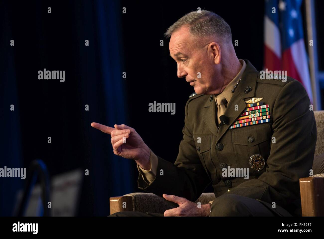 Chairman of the Joint Chiefs of Staff U.S. Marine Corps Gen. Joe Dunford and his wife Ellyn, speak alongside Student 2 Student program volunteers at the Military Child Education Coalition 2018 National Training Seminar in Washington, D.C., July 25, 2018. The themes of leadership, service, and civic responsibility wove through the discussion on three historical book selections. Stock Photo