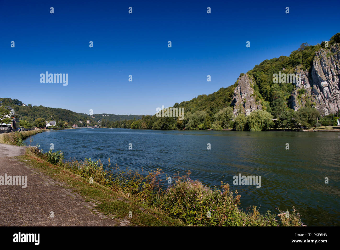 The Promenade de Meuse road along the Meuse river and the Rocks of Néviau in Wepion, south of Namur (Belgium, 05/09/2013) Stock Photo