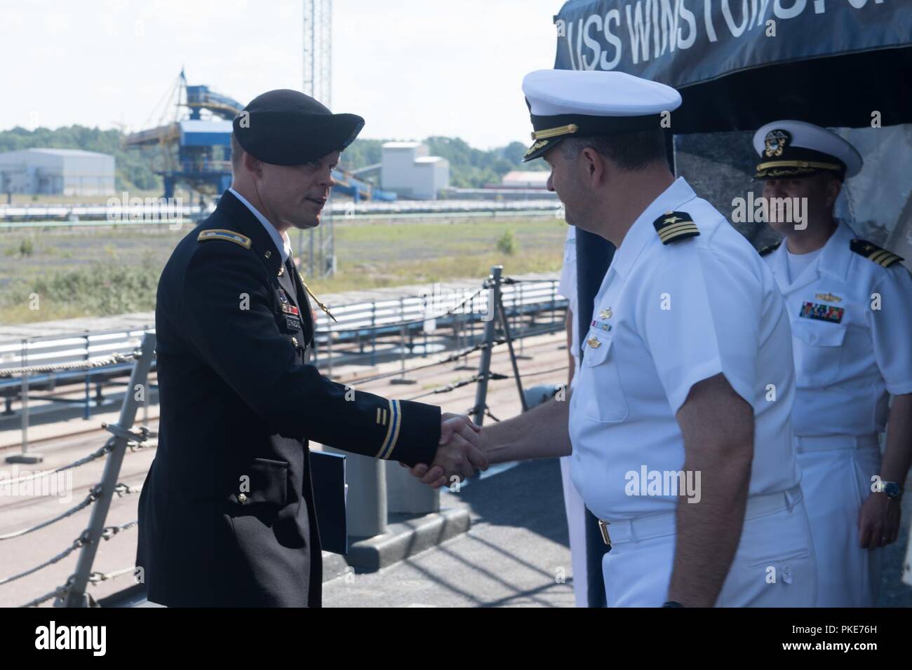 TALLINN, Estonia (July 25, 2018) Cmdr. Thomas Van Scoten, commanding  officer of the Arleigh Burke-class guided-missile destroyer USS Winston S.  Churchill (DDG 81), greets guests during a reception aboard the ship, July