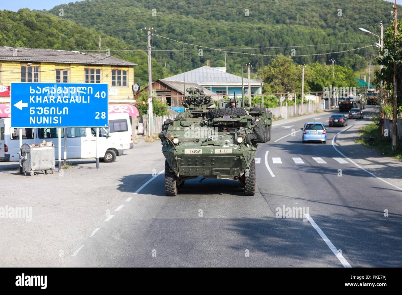 Soldiers from the 3rd Squadron, 2d Cavalry Regiment conduct a tactical road march through western Georgia, July 28, 2018. 3/2CR is scheduled to participate in Noble Partner 18 from Aug. 1 - 15. Noble Partner is a Georgian Armed Forces and U.S. Army Europe cooperatively-led exercise in its fourth iteration. The exercise is intended to support and enhance the readiness and interoperability of Georgia, the U.S. and participating nations during a multinational training operation. This exercise provides leaders at all levels the opportunity to exercise their staffs in command and control; and execu Stock Photo