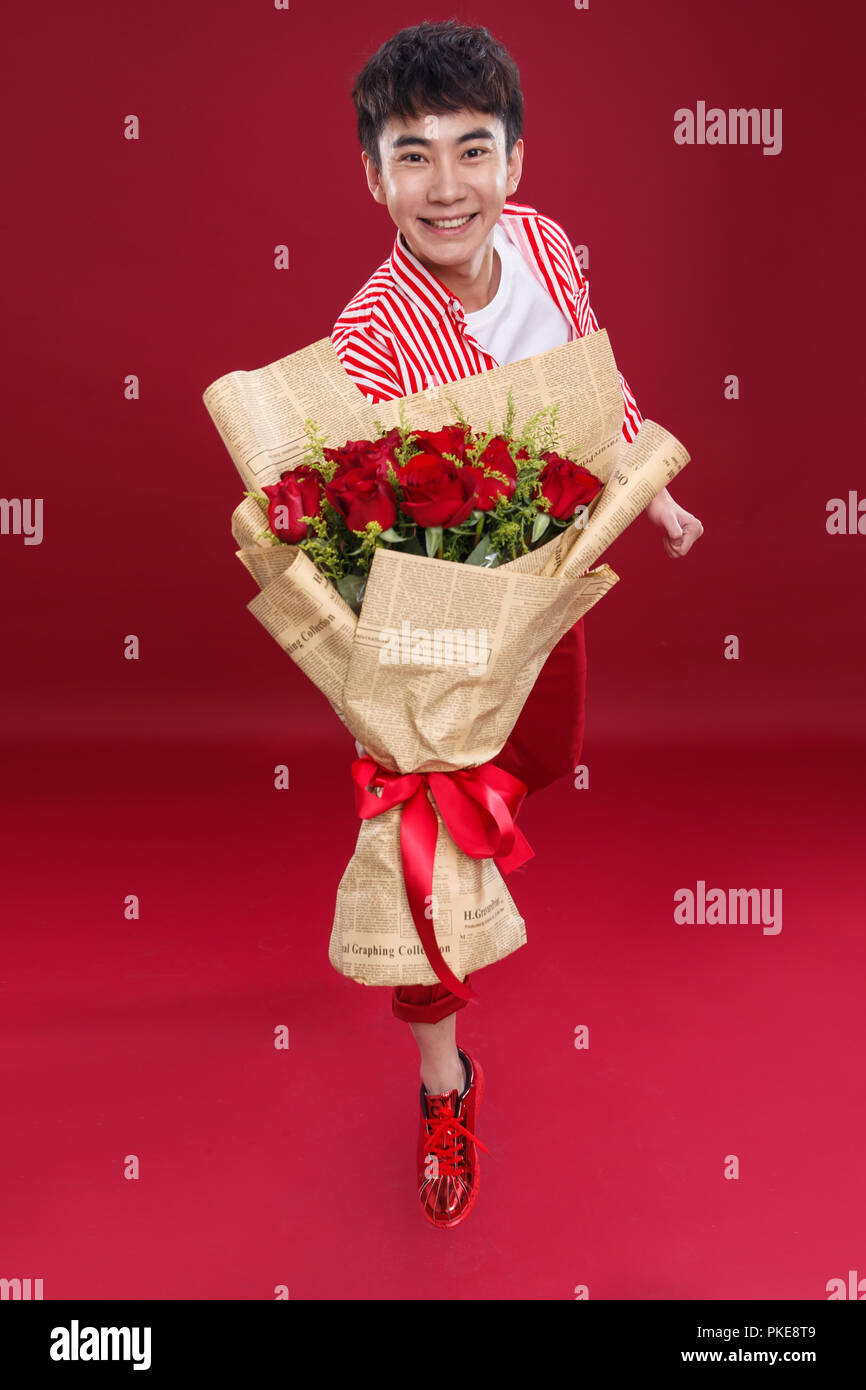 Man Carrying Roses Delivering roses hi-res stock photography and images - Alamy