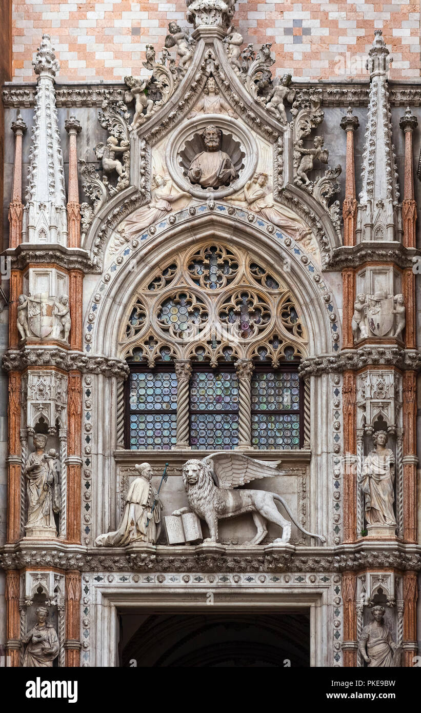 Statue of Doge and winged lion, symbol of Saint Mark, above doorway entrance to Doge's Palace, St. Mark's Square; Venice, Italy Stock Photo