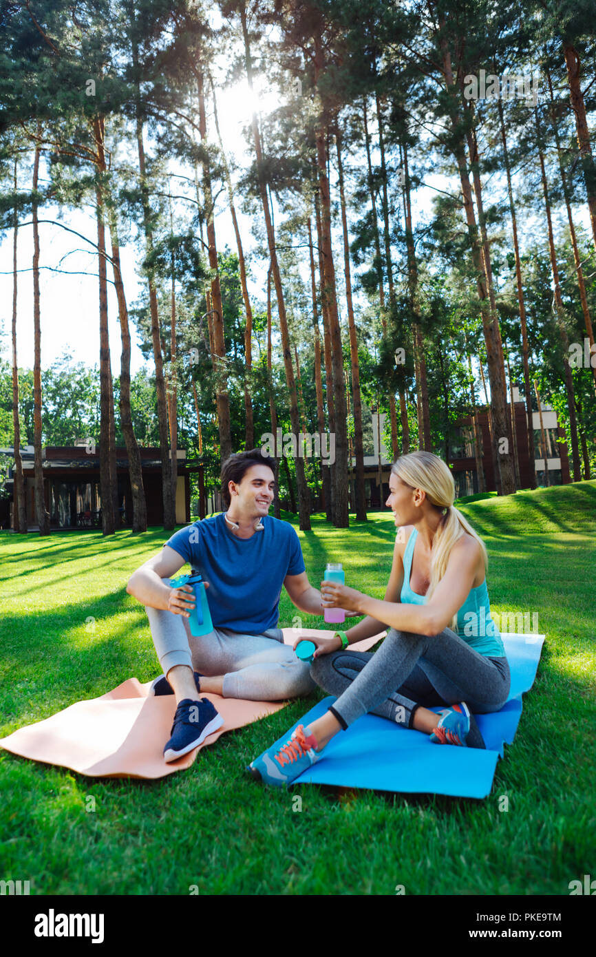 Pleasant young nice people discussing their workout Stock Photo