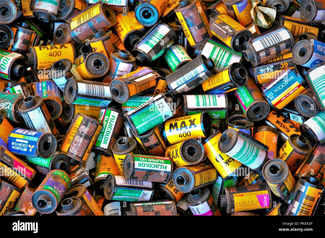 Used Film canisters as garden cover at closed processing plant in Los Angeles California USA, for sale for use in 35mm cameras Stock Photo