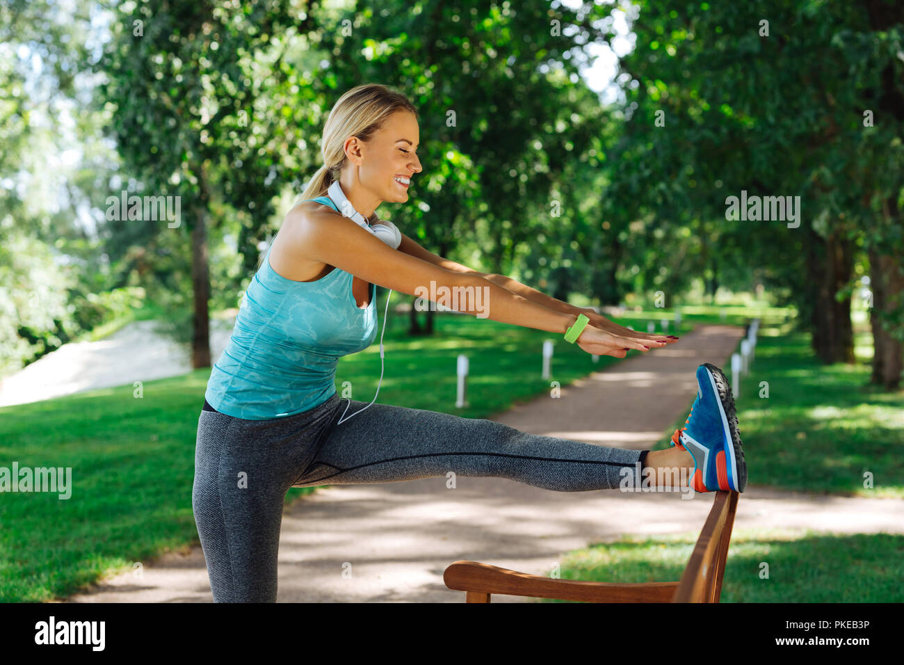 Cheerful nice woman trying to read her toes Stock Photo