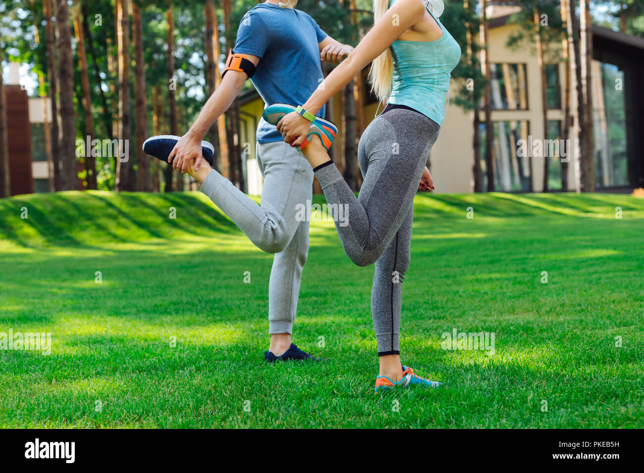 Nice young people doing a stretching exercise Stock Photo