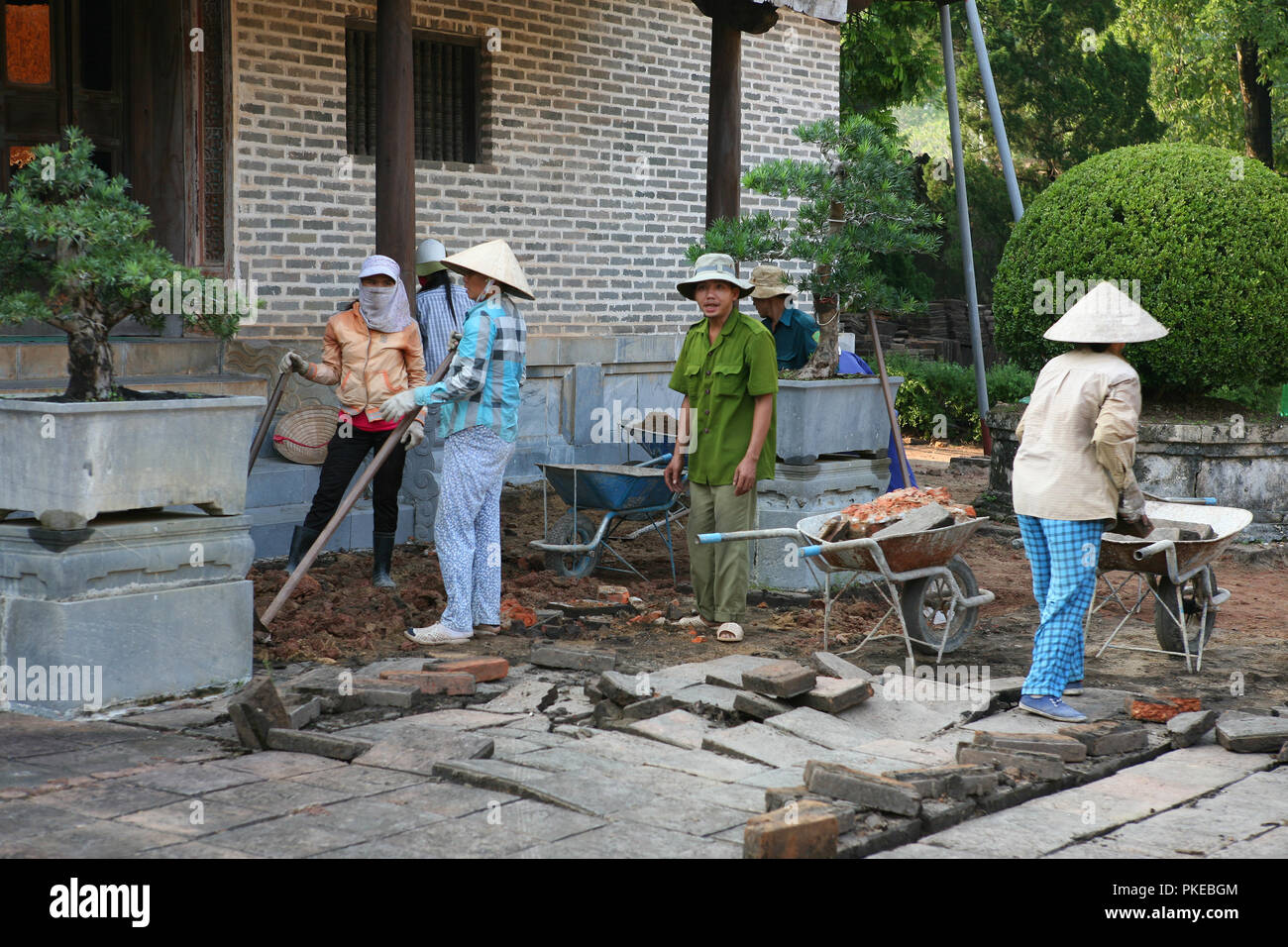 Relaying paving slabs outside Hoa Khiem Palace, Tu Duc's mausoleum, Hue, Viet Nam Stock Photo