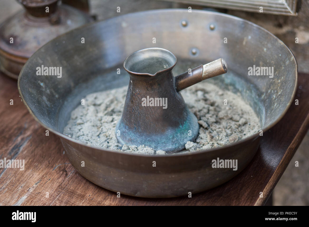 Traditional turkish coffee in cezve prepared on hot sand. Selective