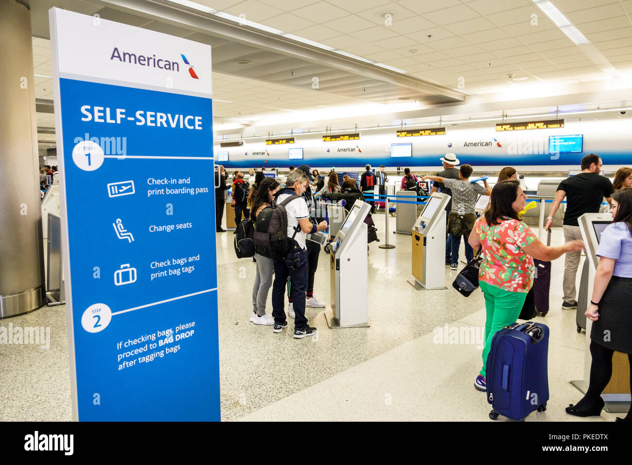Miami Florida,International Airport MIA,terminal gate,American Airlines,self-service check-in,kiosk,instruction poster,FL180813004 Stock Photo