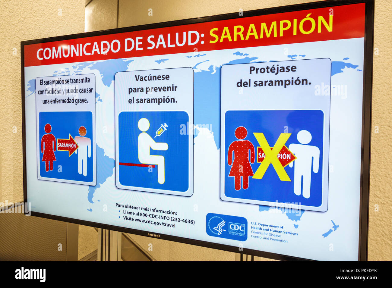 Miami Florida,International Airport MIA,health information sign,CDC,Center for Disease Control,sarampion,measles warning,vaccine,Spanish language,FL18 Stock Photo
