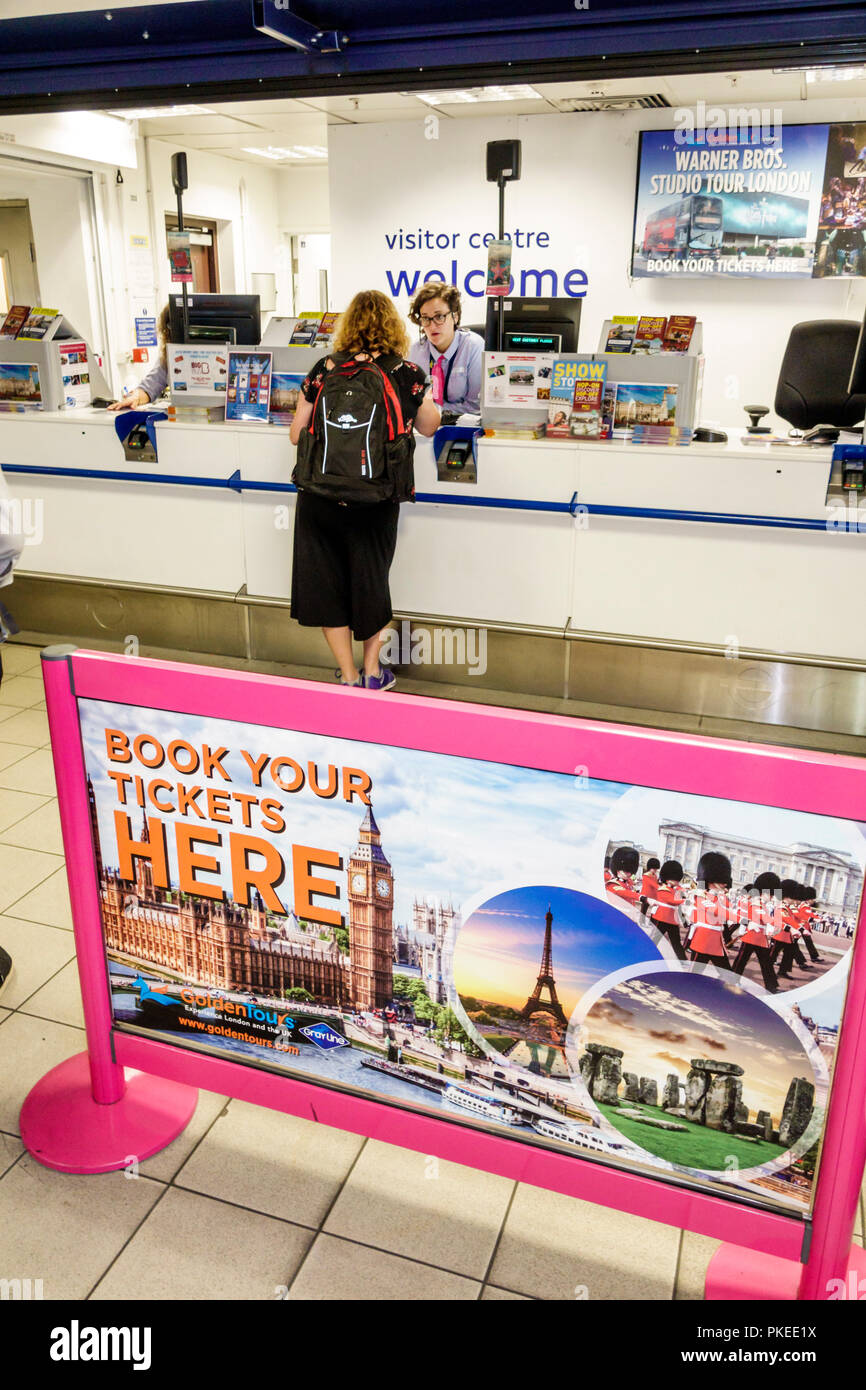 London England,UK,Heathrow Airport LHR,visitor welcome centre center,counter,woman female women,agent,UK GB English Europe,UK180814016 Stock Photo