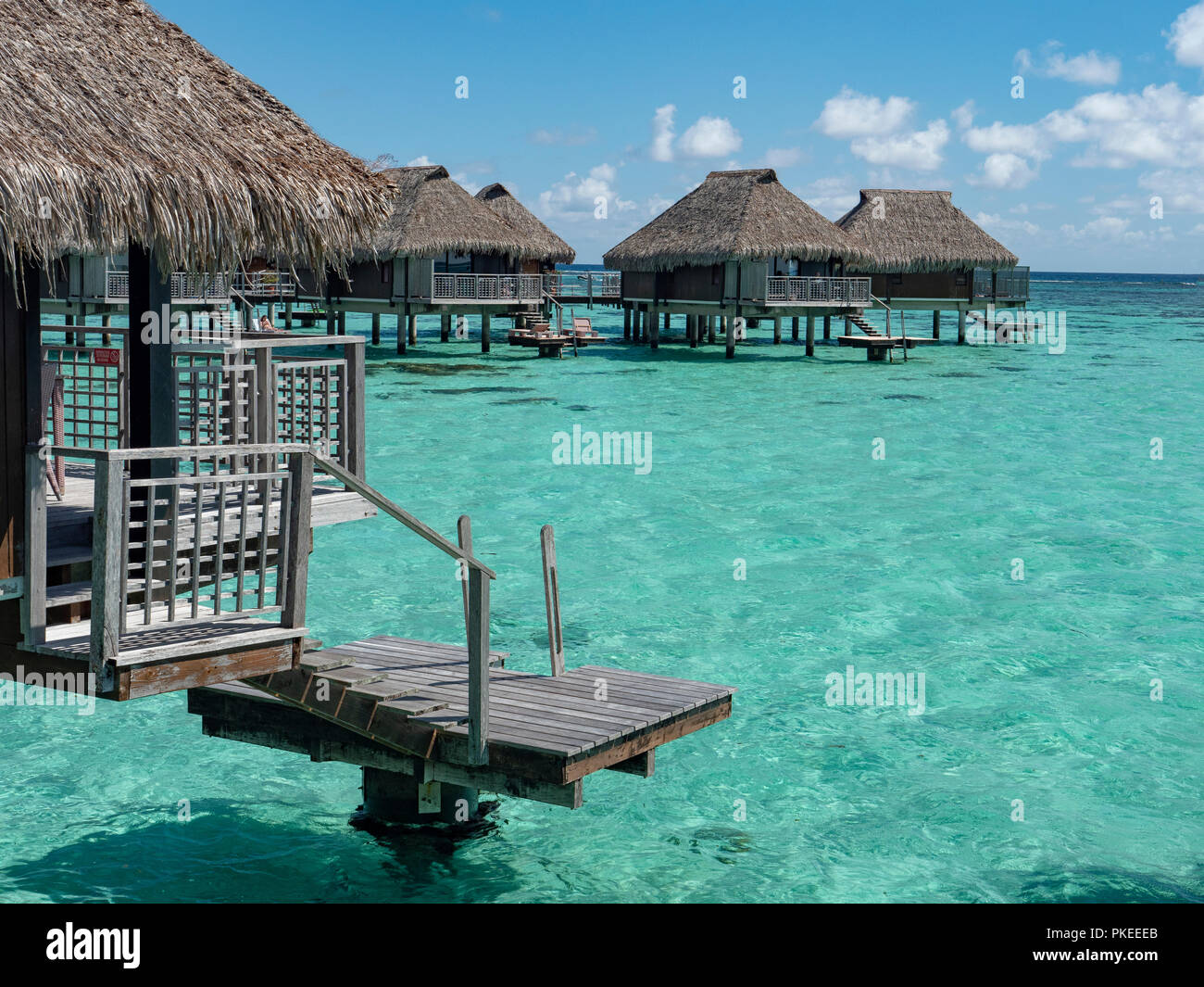 Over the water bungalows at the Hilton Lagoon Resort and Spa, Papetoai, Moorea, Tahiti, French Polynesia Stock Photo