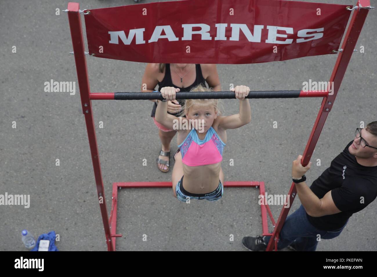 MADISON, Wisconsin – Evania Maas executes a dead hang pull-up during the 2018  Reebok CrossFit Games at the Alliant Energy Center, August 1. CrossFit  promotes both a physical exercise philosophy and competitiveness,