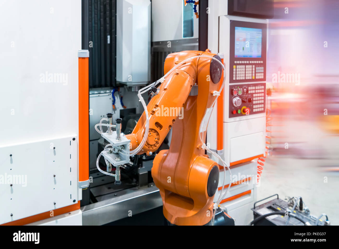 robotic arm machine tool at industrial manufacture plant,Smart factory industry 4.0 concept. Stock Photo