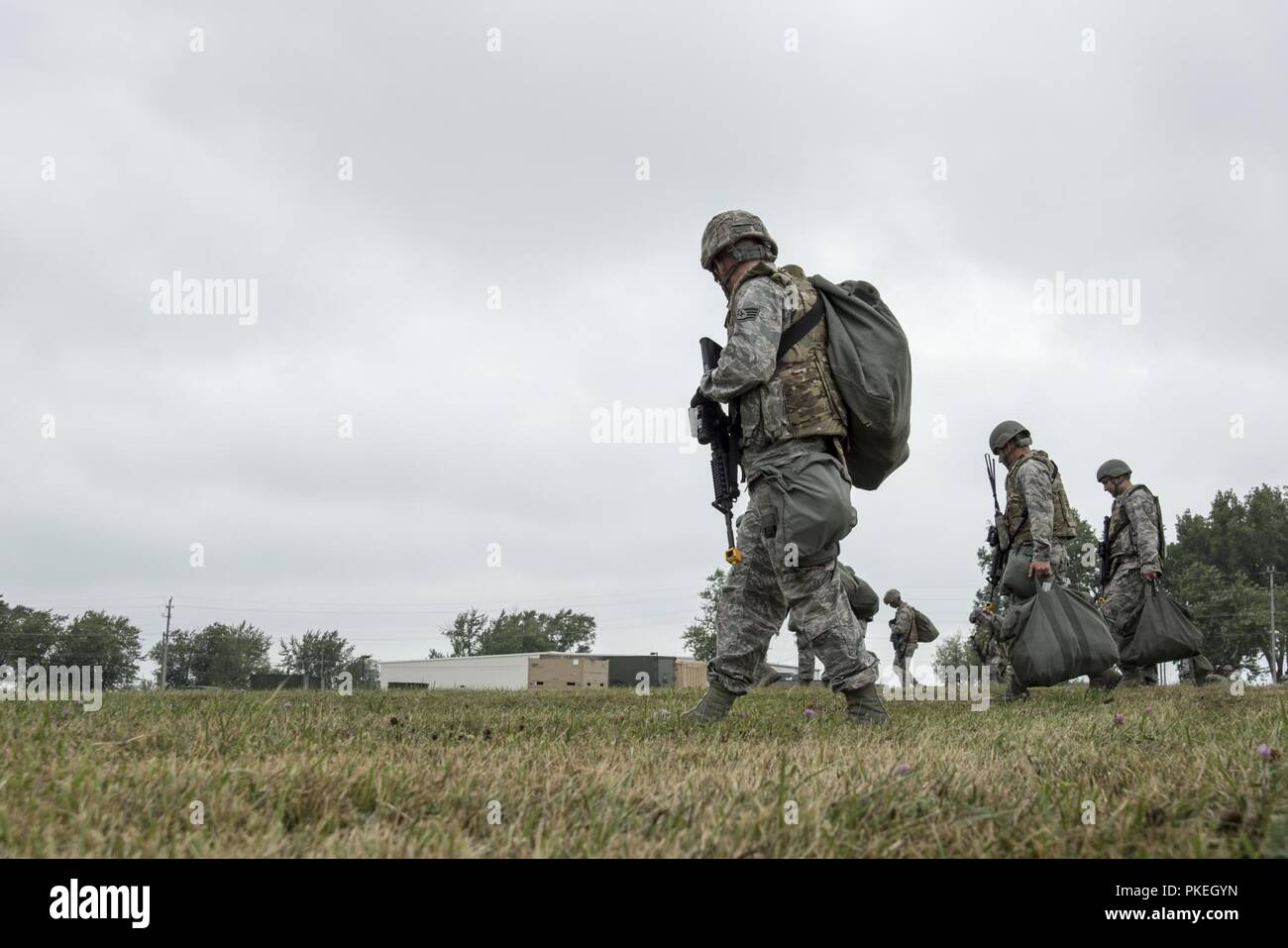 Airmen of the Ohio Air National Guard, 200th RED HORSE Squadron, conduct a multi-day Field Training Exercise at Camp Perry, OH., incorporating construction and civil engineering elements while simulating hostile conditions, Aug. 1, 2018. About 400 Airmen participated in this year's training in support of the RED HORSE mission to provide a dedicated, mobile, flexible, self-sufficient heavy construction engineering force for airfield, base infrastructure and special capabilities to support worldwide contingency operations. Stock Photo