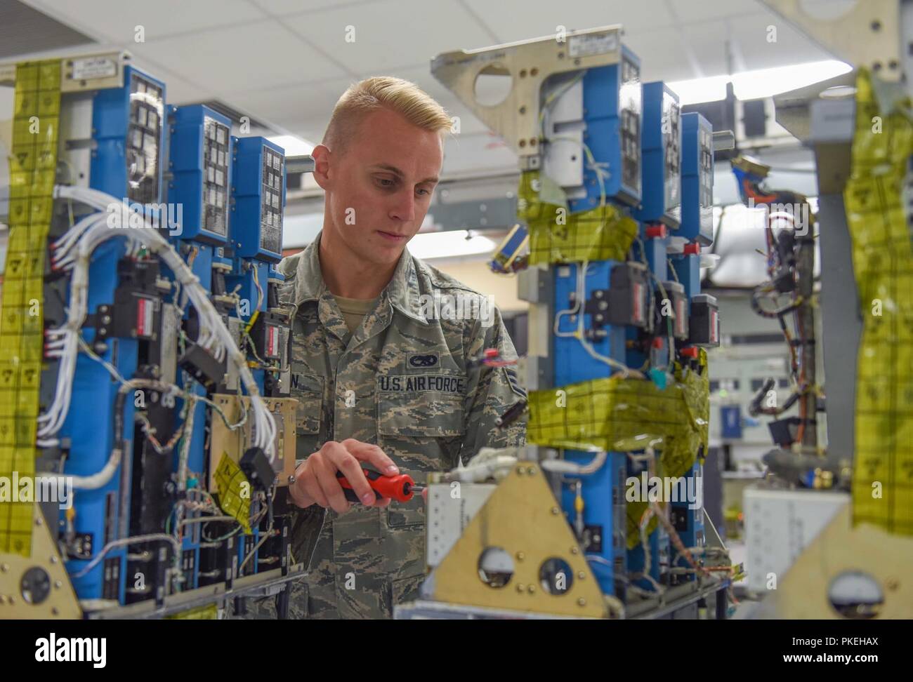 Senior Airman Jacob Heston, 7th Component Maintenance Squadron avionics journeyman, validates parts on a transmitter at Dyess Air Force Base, Texas, Aug. 8, 2018. From the innovations that earned the avionics flight the 2017 Chief of Staff Team Excellence Award, they were able to increase their production rates by 50 percent, as well as save the Air Force approximately $11.8 million. Stock Photo