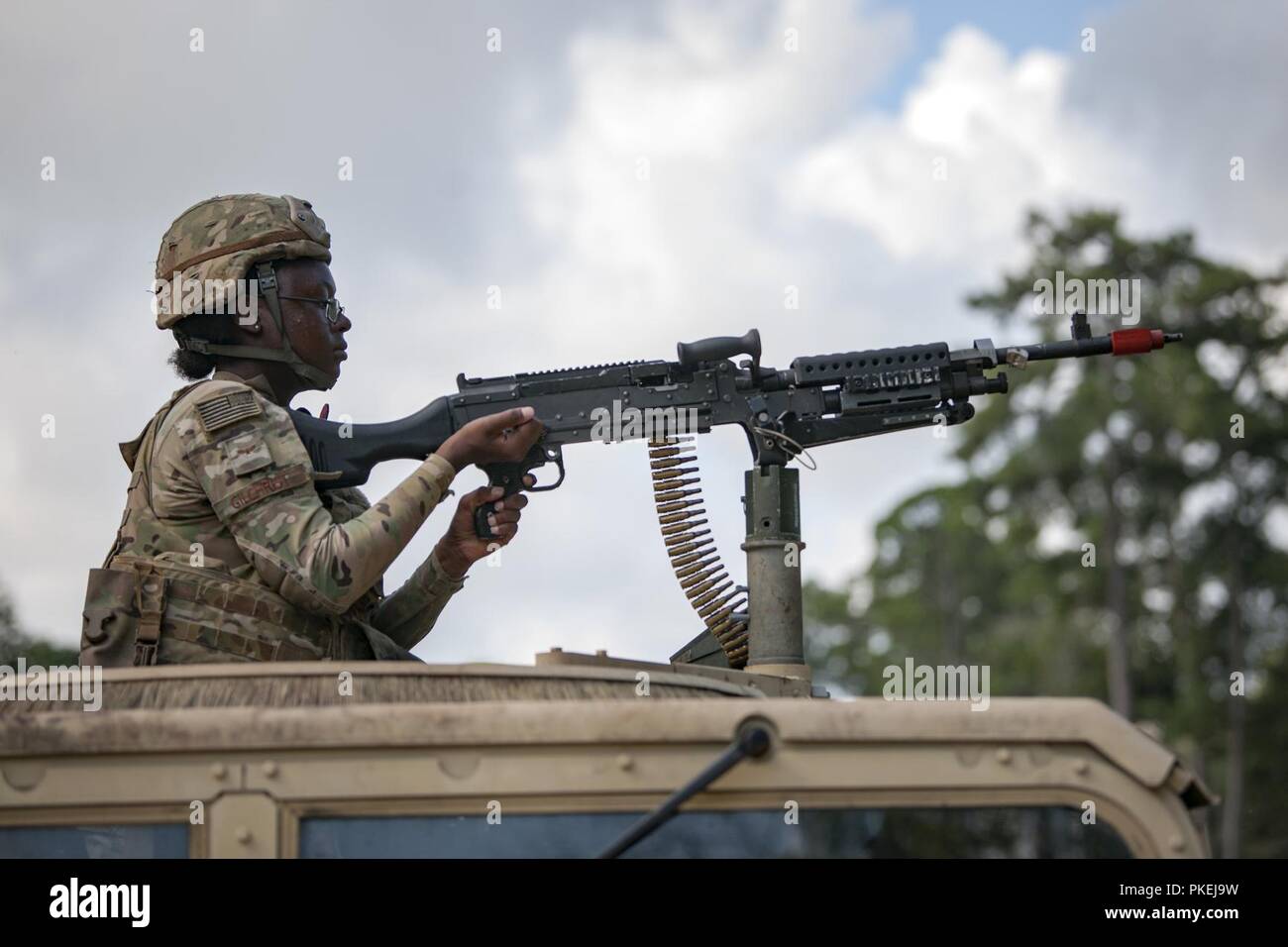 Airman 1st Class Zaire Gilchrist, 822d Base Defense Squadron (BDS) fireteam member, fires an M240B machine gun during a full mission profile assessment, July 24, 2018, at Moody Air Force Base, Ga. The ‘Safeside’ defenders evaluated their base defense tactics and procedures while performing patrols, tactical combat casualty care and countering improvised explosive devices for a mission readiness exercise. After successfully completing these events, the defenders are eligible to earn their Global Response Force status, which certifies the unit to deploy worldwide. Stock Photo