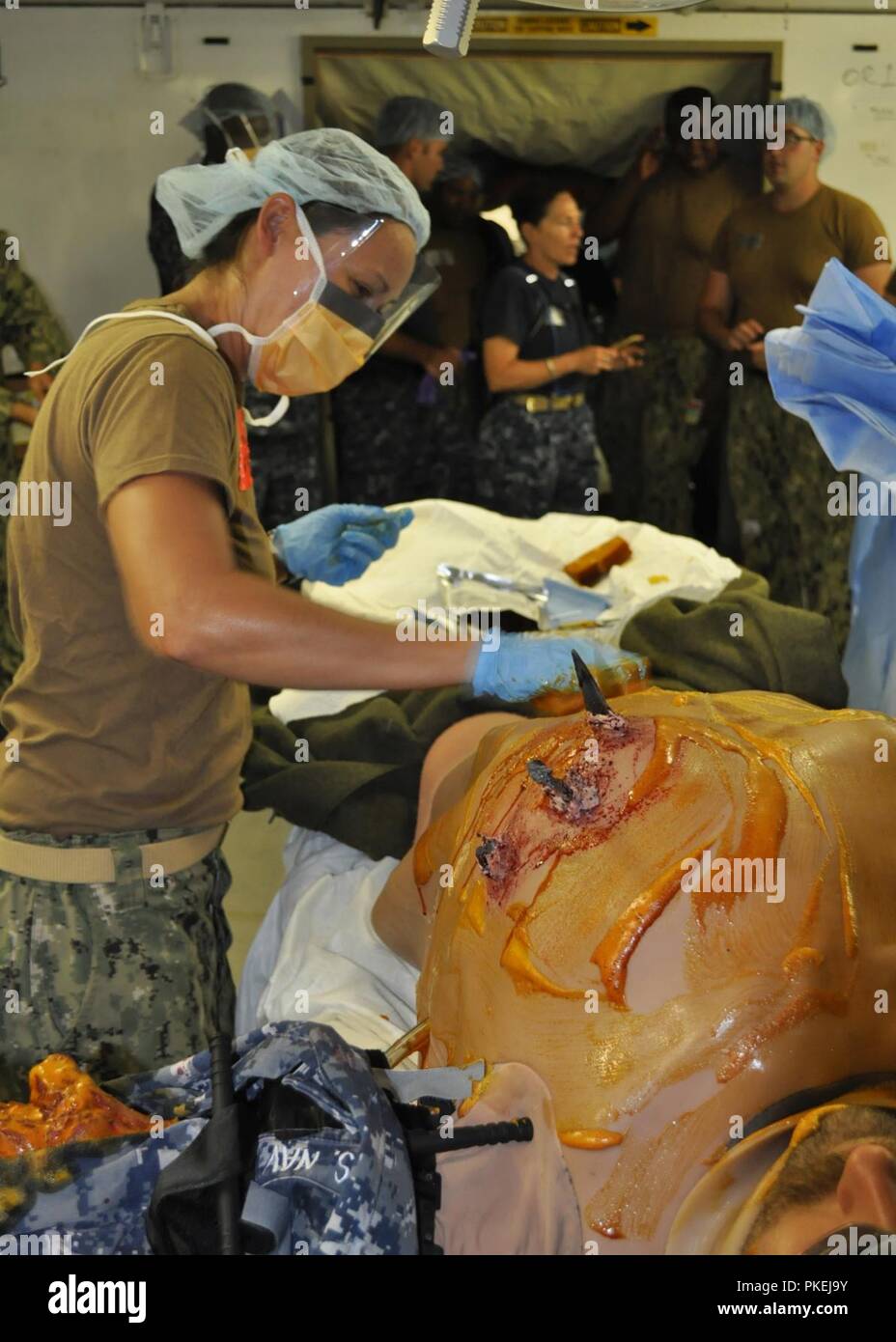 CAMP PENDELTON, Calif. (July 25, 2018) – Lt. Shelah Roanhorse prepares a simulated casualty for surgery during an Expeditionary Medical Facility (EMF) training course at Naval Expeditionary Medical Training Institute (NEMTI). EMF is the Navy’s largest land-based medical platform, which meets the requirement to establish, operate and maintain a medical facility overseas that remains readily deployable. NEMTI is a detachment of Navy Medicine Operational Training Center (NMOTC), whose mission is to provide operational medical and aviation survival training. Stock Photo