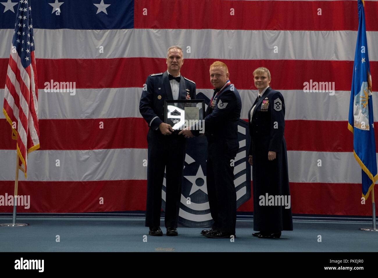 Technical sergeants celebrate their selction for master sergeant during a senior NCO induction ceremony at Barksdale Air Force Base, La., Aug. 10, 2018. Stock Photo