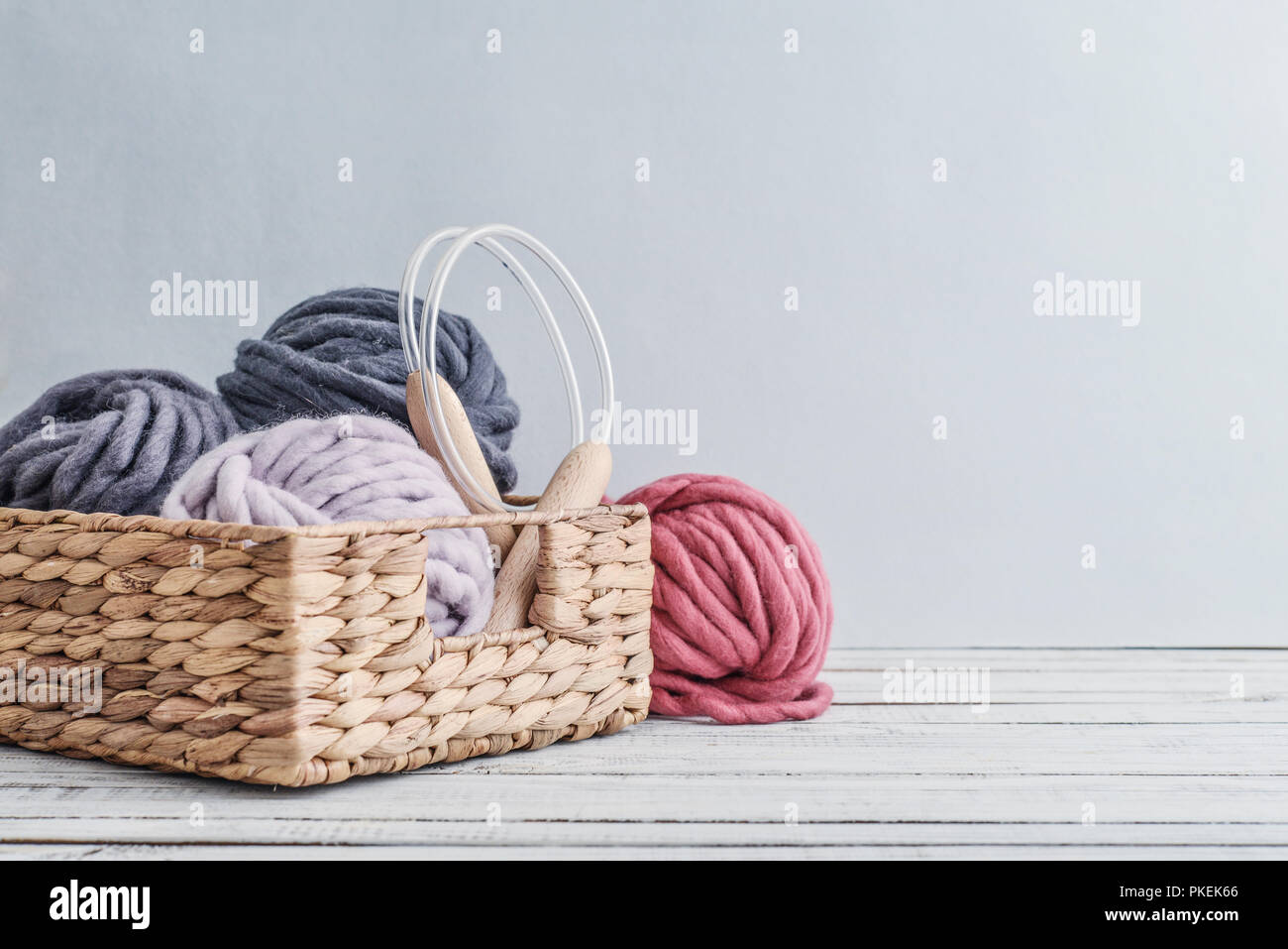 wooden knitting needles on background of grey merino wool blanket Stock  Photo - Alamy