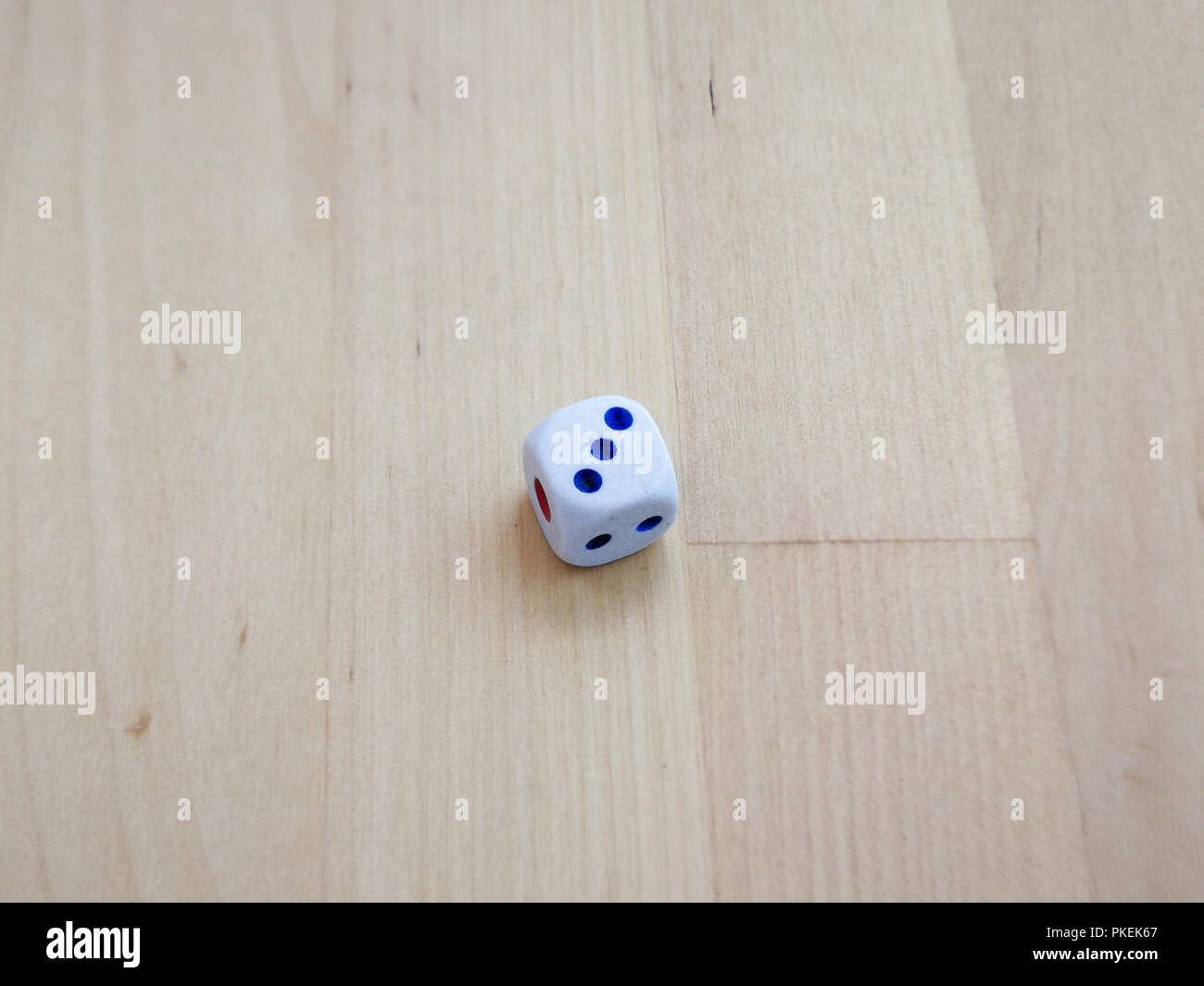 White dice isolated on wooden background Stock Photo - Alamy