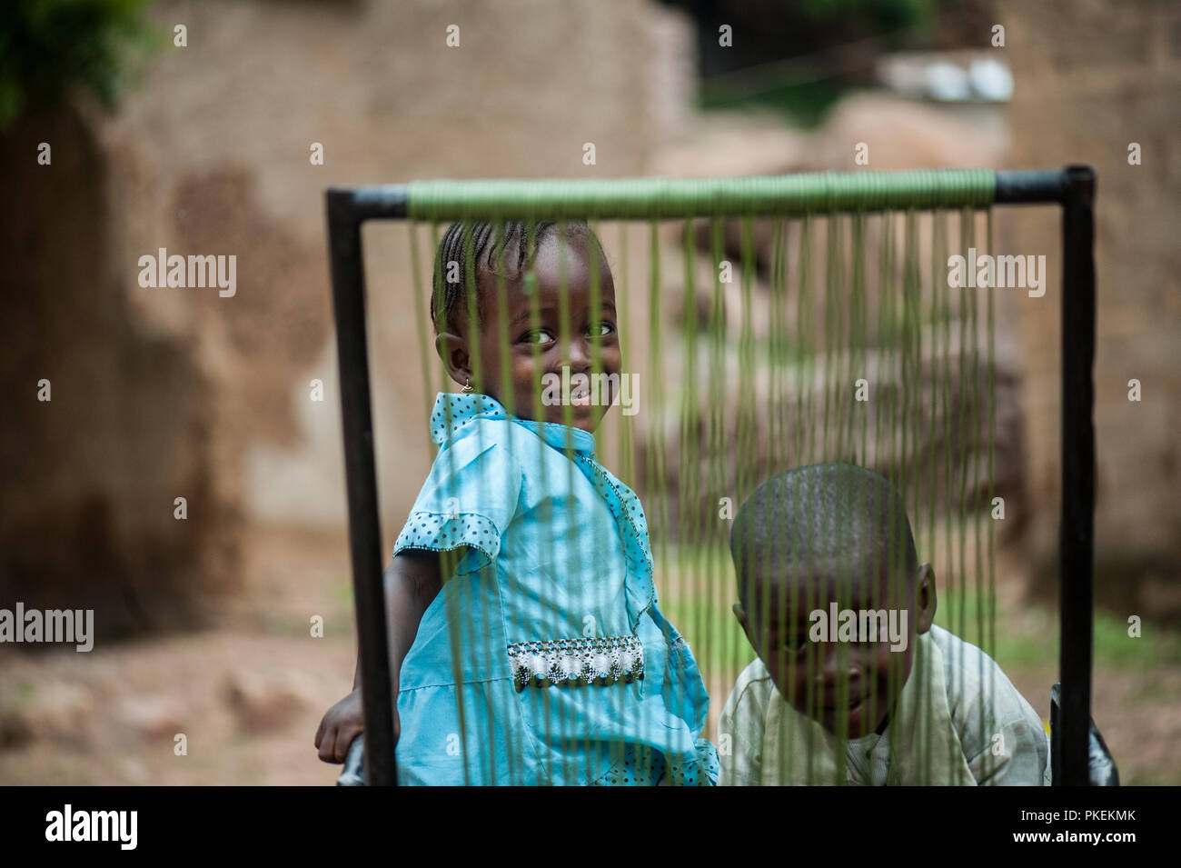 Mali, Africa - circa August 2009 - Black african children having fun with a  plastic chair outside home living in a rural area near Bamako Stock Photo -  Alamy