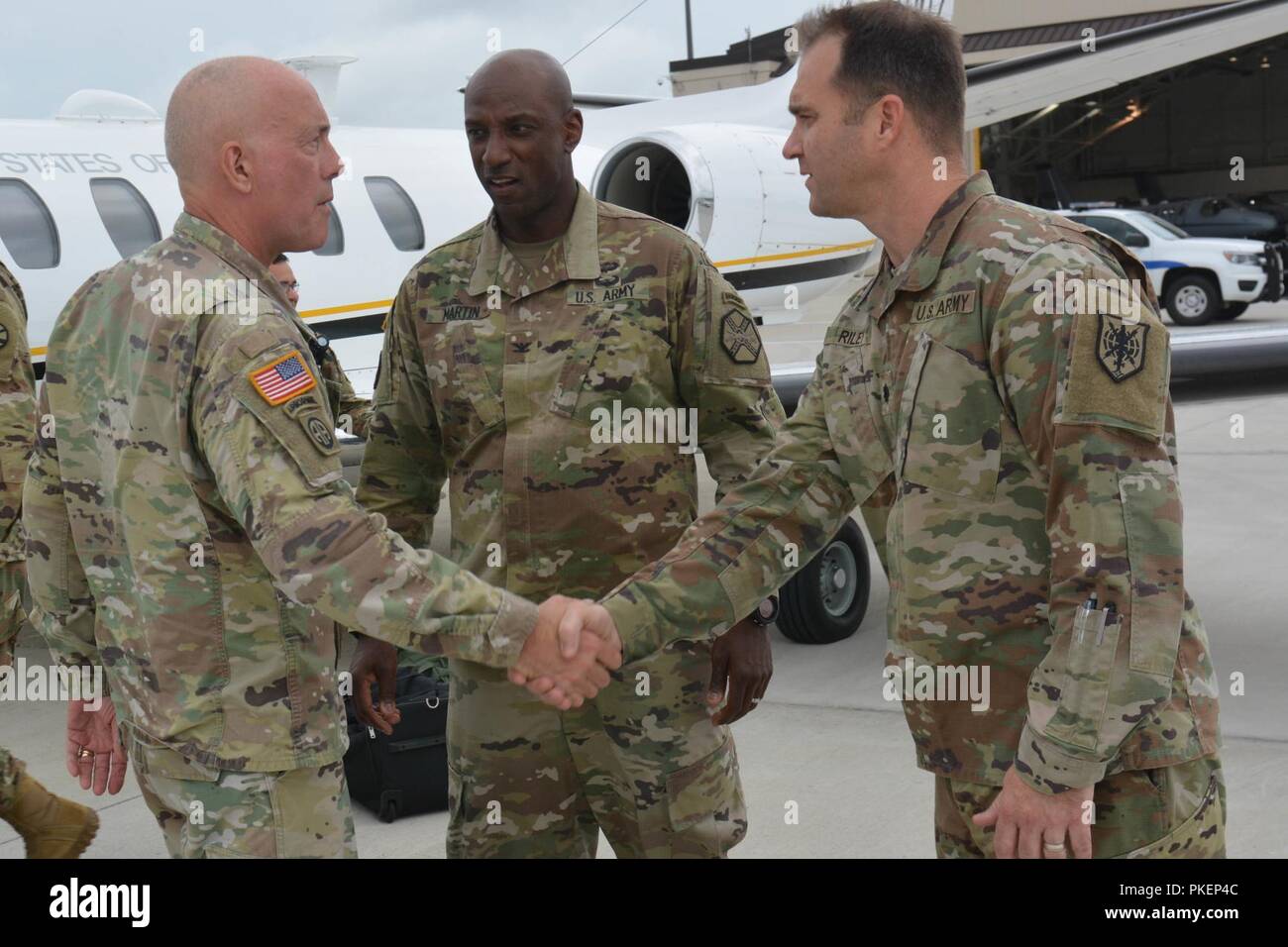 U.S. Army Reserve Lt. Col. William Riley, commander, 325th Military Intelligence Battalion, greets LTG Charles D. Luckey, Chief of Army Reserve and Commanding General, U.S. Army Reserve Command, during his visit to Task Force Ultimate, Operation Cold Steel II, hosted by U.S. Army Civil Affairs and Psychological Operations Command (Airborne), July 25, 2018 at Joint Base McGuire-Dix-Lakehurst, N.J. Operation Cold Steel is the U.S. Army Reserve's crew-served weapons qualification and validation exercise to ensure America's Army Reserve units and Soldiers are trained and ready to deploy on short n Stock Photo