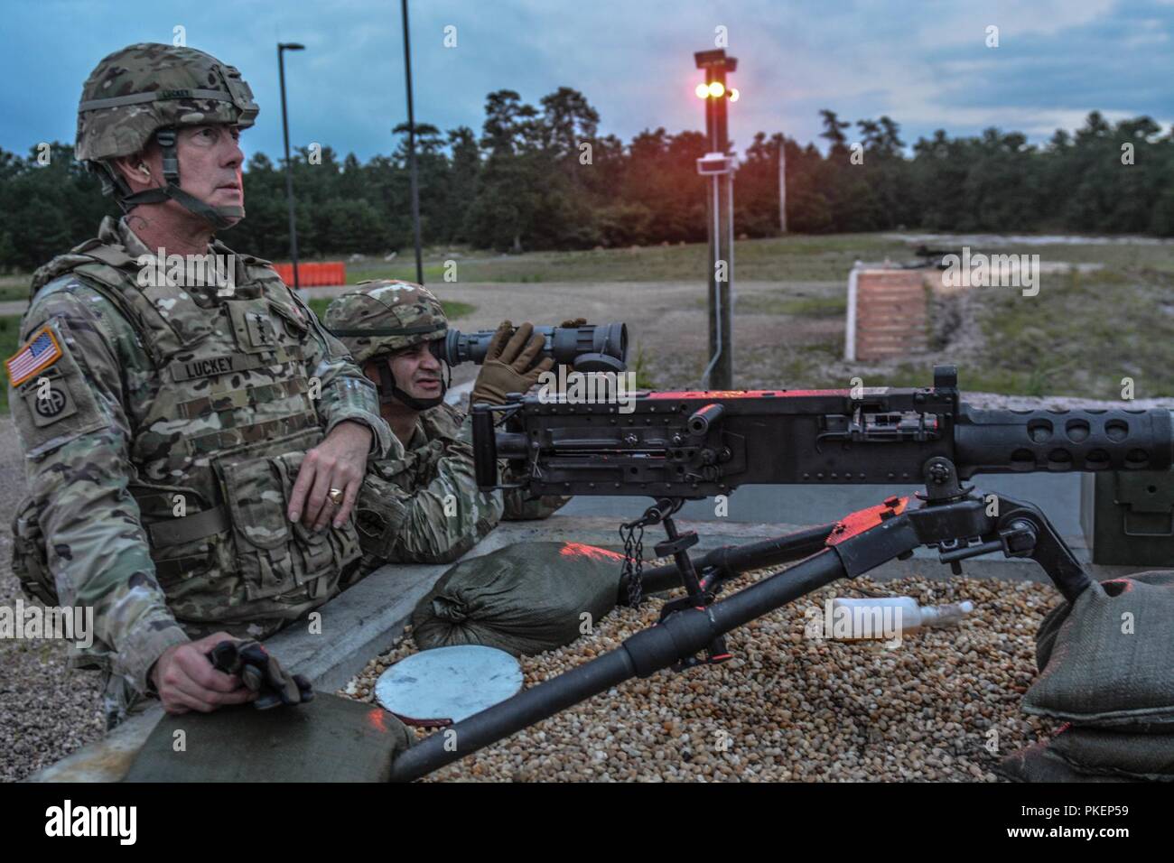 LTG Charles D. Luckey, Chief of Army Reserve and Commanding General, U.S. Army Reserve Command, prepares to fire an M2 machine gun during Task Force Ultimate, Operation Cold Steel II, hosted by U.S. Army Civil Affairs and Psychological Operations Command (Airborne), July 25, 2018 at Joint Base McGuire-Dix-Lakehurst, N.J. Operation Cold Steel is the U.S. Army Reserve's crew-served weapons qualification and validation exercise to ensure America's Army Reserve units and Soldiers are trained and ready to deploy on short notice as part of Ready Force X and bring combat-ready and lethal firepower in Stock Photo
