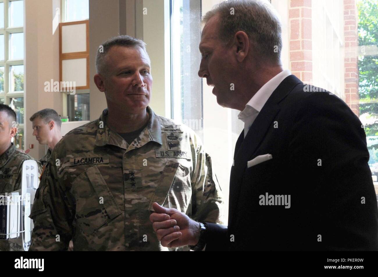 U.S. Deputy Secretary of Defense Patrick M. Shanahan speaks with U.S. Army Lt. Gen. Paul LaCamera, commanding general, XVIII Airborne Corps and Fort Bragg, at Womack Army Medical Center, Fort Bragg, N.C., July 26, 2018. Stock Photo