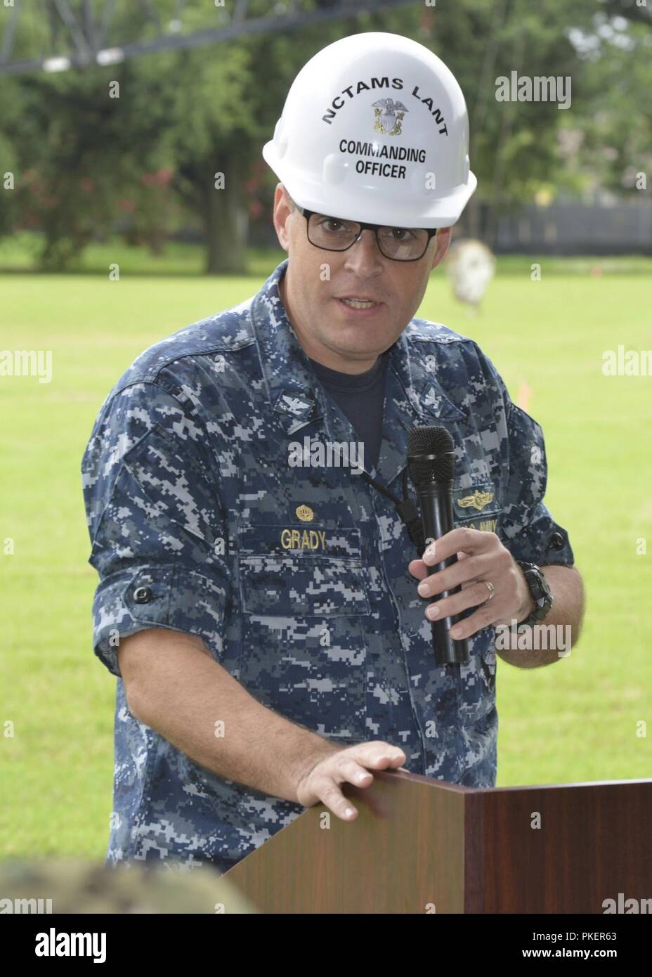 Captain Jody Grady, Commanding Officer, Naval Computer and Telecommunications Area Master Station Atlantic (NCTAMS LANT) speaks at the Groundbreaking Ceremony on Norfolk Naval Station, to officially commence the P913 site project of NCTAMS LANT’s new building.  The ceremony was conducted Thursday, July 26 at 9 a.m. across from the base’s parade field where the new building will be located.  NCTAMS LANT’s mission is to operate and defend responsive, resilient, and secure computer and telecommunications systems, providing information superiority for global maritime and joint forces. U.S. Navy Stock Photo