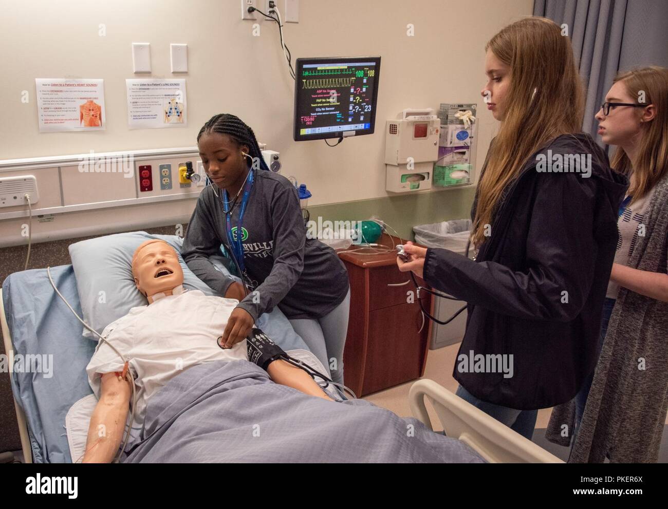 Charleston, S.C. (July 26, 2018) Attendees from the seventh annual Girls Day Out (GDO) get hands-on experience with medical professionals during a learning session at Trident Technical College (TTC). More than 100 girls from four Lowcountry school districts attended the camp, hosted by Space and Naval Warfare Systems Center (SSC) Atlantic in collaboration with TTC via Cyber Secure, College of Charleston, Bosch, Naval Health Clinic Charleston, Paul Mitchell the School Charleston, and Nucor Steel Berkeley. Girls Day Out is a camp designed to promote science, technology, engineering, and mathemat Stock Photo